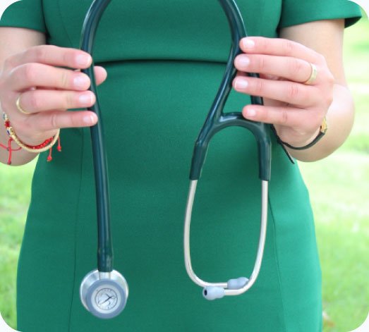 Close-up of a dual-certified psychiatric professional holding a stethoscope for holistic mental healthcare in Katy, Texas.